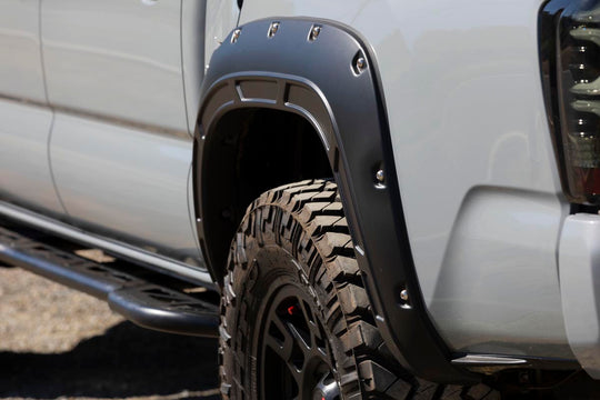 A-T11621-202 Defender Pocket Fender Flares - Black - Toyota Tacoma (16-23) Rough Country Canada